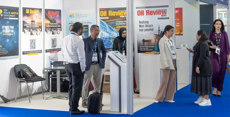 People in discussions at the Oil Review Middle East exhibition stand