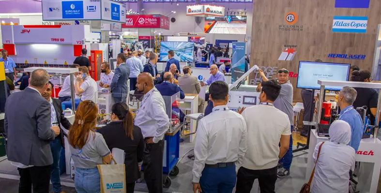 Trade exhibition with many people at stands