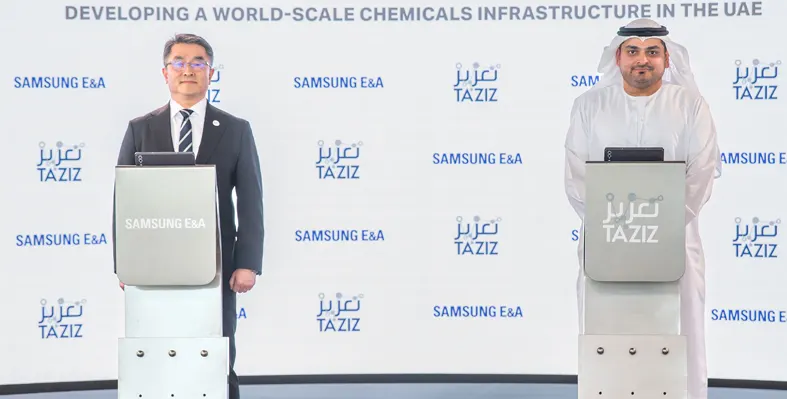 Image of two man standing behind podiums 