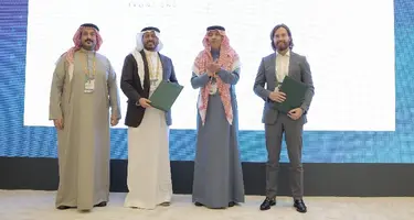 Picture of four men at agreement signing