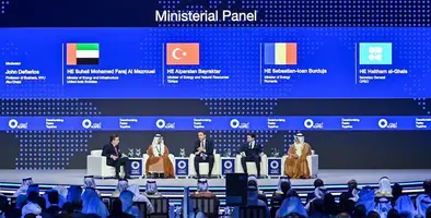 Panel session at a conference with five people sitting