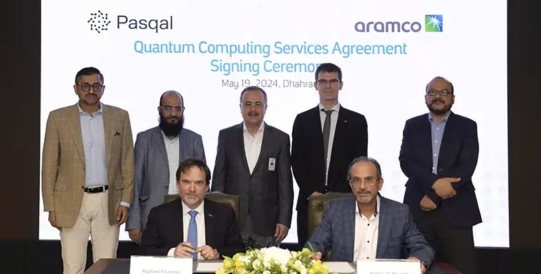 Picture of an agreement signing. 