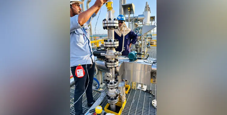 technicians_servicing_valve_assembly