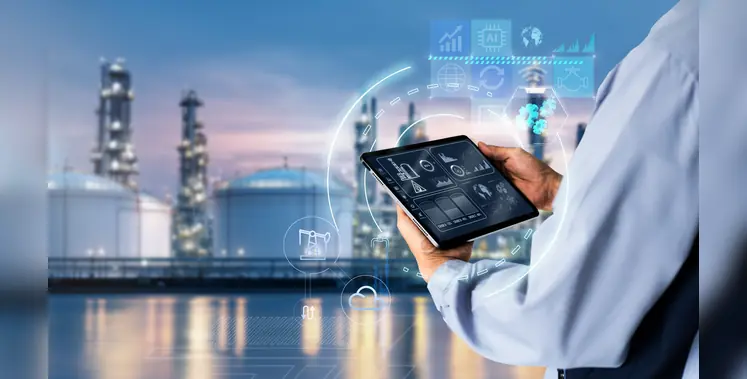 worker_with_tablet_against_refinery_background