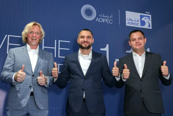 (L-R): MYCRANE's Piet Kraaijeveld, Andrei Geikalo, Aleksandr Geikalo. (Image source: ADIPEC)