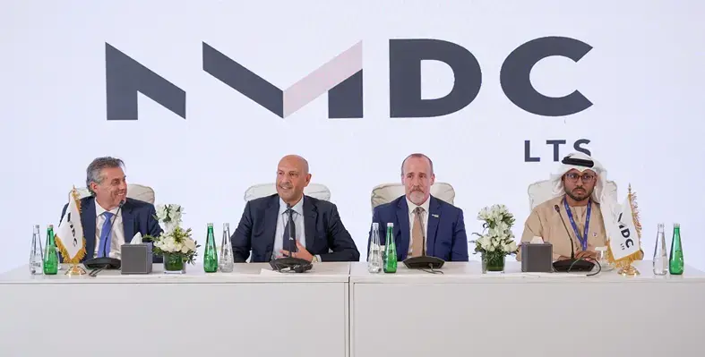 The new business unit will leverage NMDC Group’s experiences and capabilities in the logistics and technical services sector. (Image source: NMDC Group) Four men sitting at a table for a signing ceremony