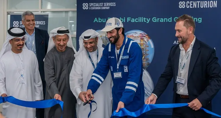 Men cutting ceremonial ribbon