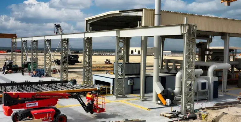 The fabrication yard will form part of a wider maritime and offshore cluster which designed to support the energy industry. (Image source: NMDC Energy) fabrication yard with lifting machinery